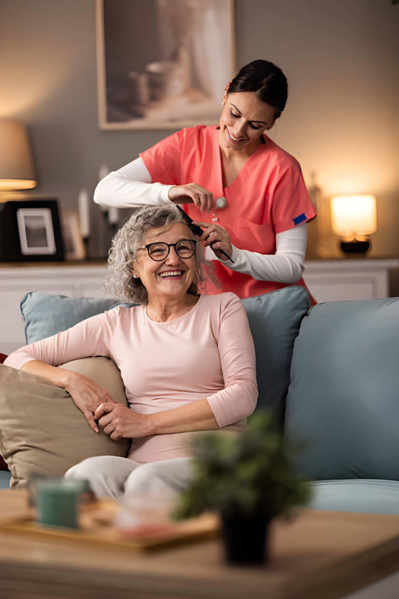 Older adult smiling during personal grooming assistance