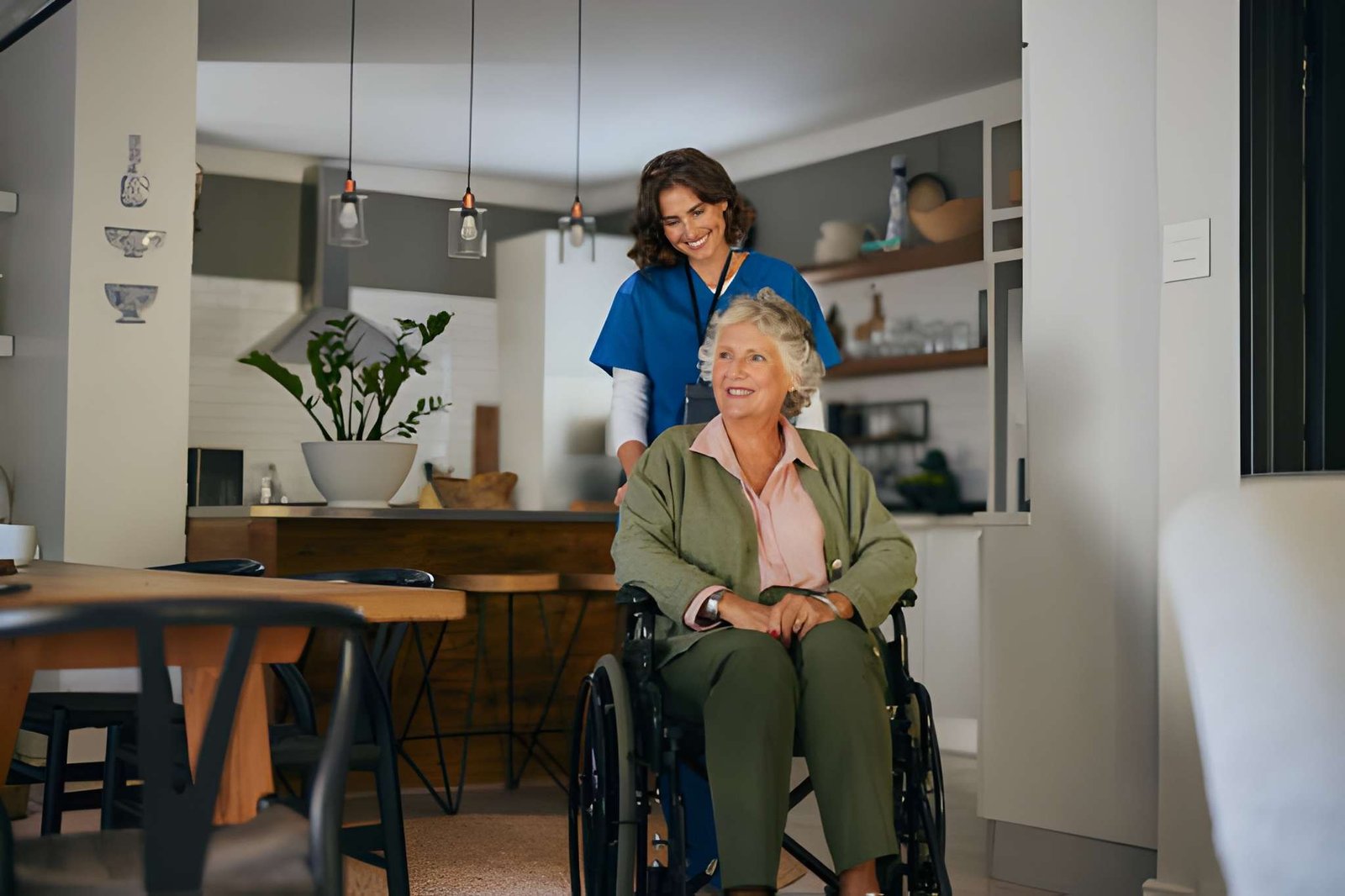 Caregiver supporting an older adult who uses a wheelchair